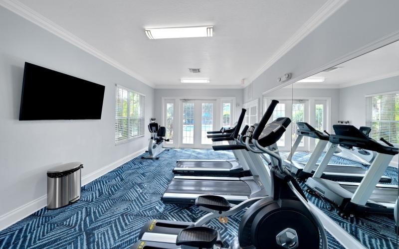 a room with treadmills and treadmills