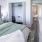 a bathroom with a bed and bathtub