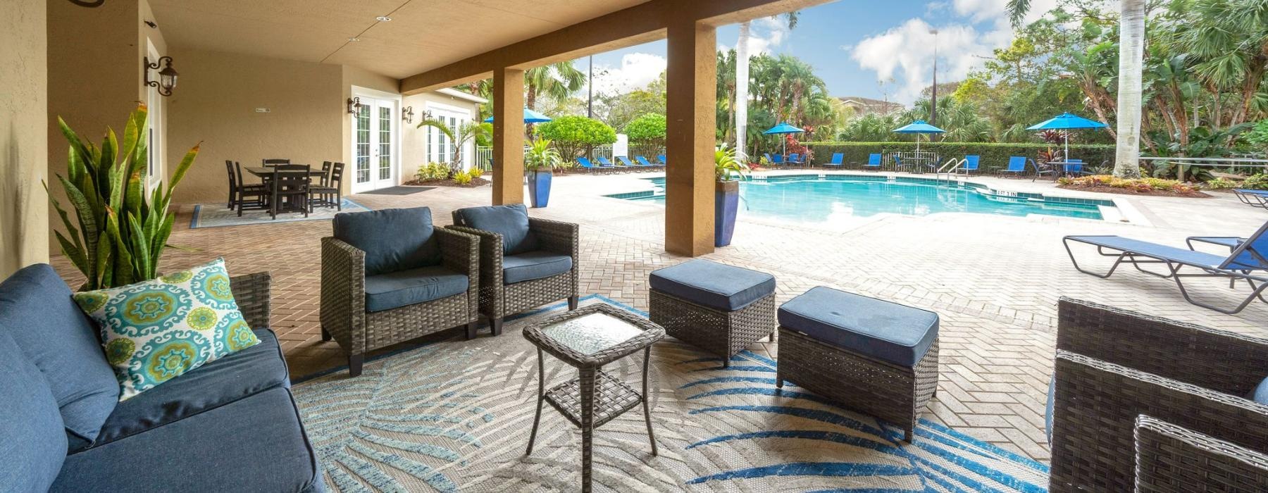 a large room with a pool and chairs